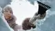 person-removing-snow-car-window-1733167506.jpg