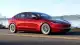 2024-tesla-model-3-red-driving-front-3qtr-1736263204.jpg