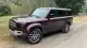 2025-land-rover-defender-burgundy-front-left-3qtr-1745853639.jpg